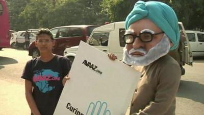 Demonstrators gather outside the court in Delhi