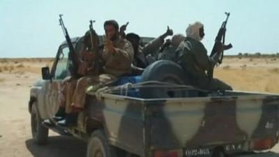 Armed Malian rebels on a truck