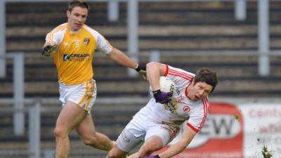 Sean Cavanagh battles with Tony Scullion in Tyrone's match against Antrim earlier this month