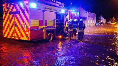 Firefighters deal with floodwater in Llanddowror