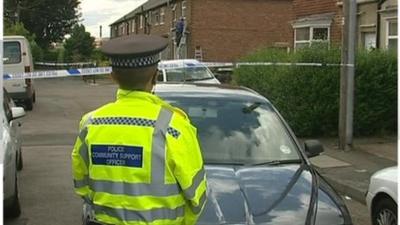 Front line police staff at a crime scene