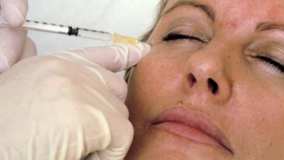 Woman has botox injected