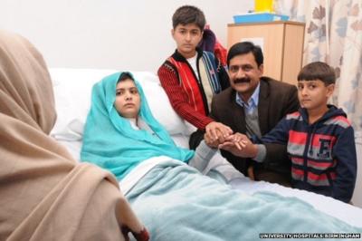 Malala Yousafzai surrounded by family