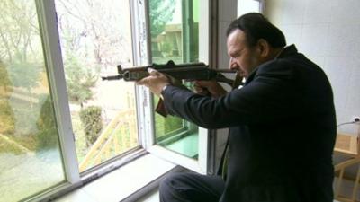 Governor of Parwan Basir Salangi with a gun