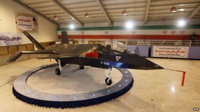 Iran's domestically designed and built Qaher F-313 fighter jet is unveiled during a ceremony in a warehouse in Tehran, 2 February 2013