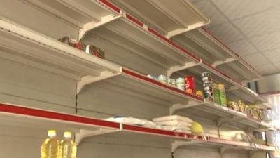 almost empty shelves in grocery store