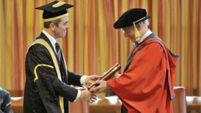 Sir Ian McKellen recieves his doctorate from university chancellor James Nesbitt