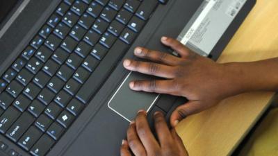 Child's hands on keyboard