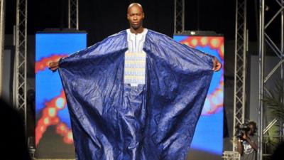 A model presents an outfit by Alphadi during the 10th Dakar Fashion Week, in 2012