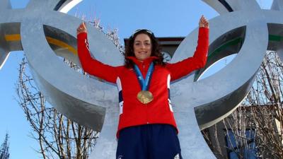 Amy Williams celebrates with her Gold Medal