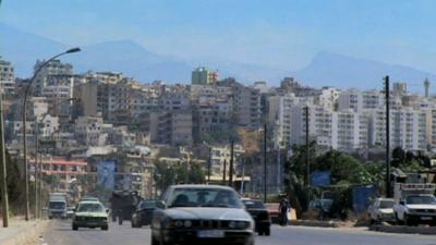 Skyline of Tripoli, showing Bab al-Tabbana (foreground) and Jabal Muhsin (background)