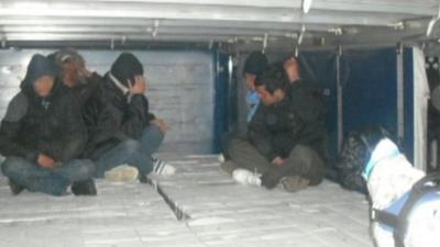 Illegal immigrants in the back of a lorry