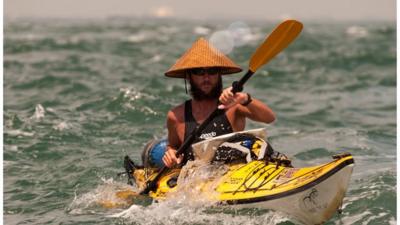 Jason Lewis in a kayak