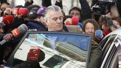 Luis Barcenas is surrounded by journalists