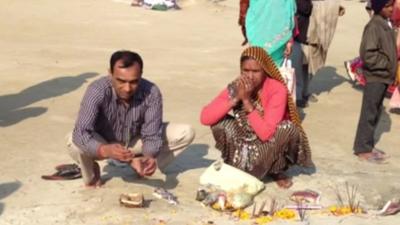 Devotees offering puja