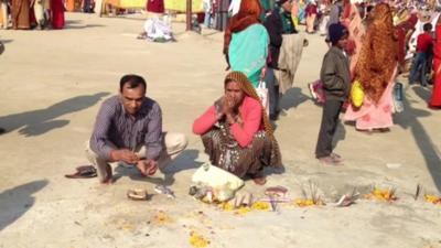 Devotees offering puja