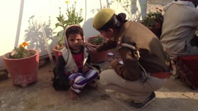 Child with lost and found officer