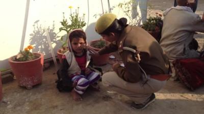 Child with lost and found officer