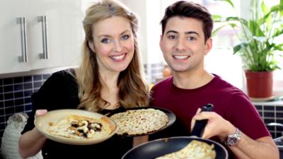 Hayley Hassall and Ricky Boleto making pancakes