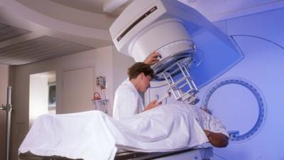 Male patient in a radiation unit undergoing treatment for cancer