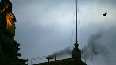 Black smoke rising from chimney of the Sistine Chapel in 2005