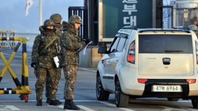 South Korean soldiers check vehicles on a road near the demilitarized zone dividing the two Koreas