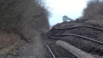 Track on its side with colliery in background