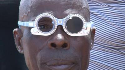 A man having his eyes tested in Kenya