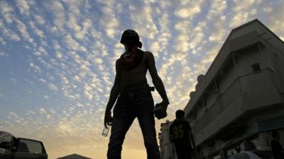 A masked Bahraini anti-government protester