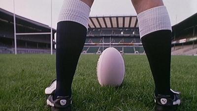 A rugby player and rugby ball