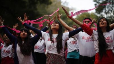 Activists dance in an event to support "One Billion Rising" global campaign in New Delhi, India