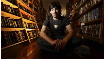 Aaron Swartz in a library