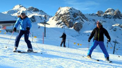 Vancouver Gold Medallist Amy Williams (Left) gets a skiing lesson from Graham Bell