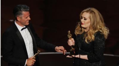 Paul Epworth and Adele Adkins accept their Oscars onstage