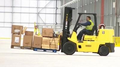 Forklift truck in warehouse