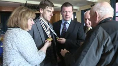 Martyn Irvine shows off his world championship medals in Dundalk on Tuesday