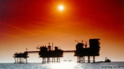 Oil rigs in silhouette