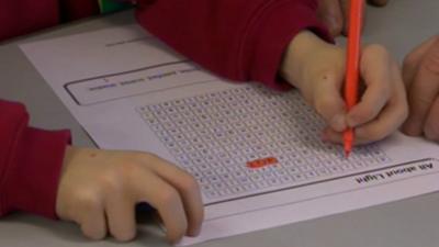 Pupil working at desk