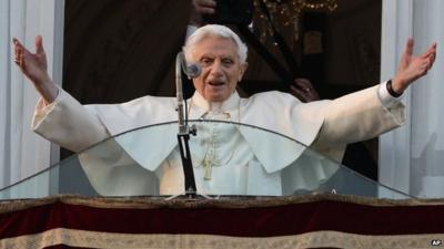 Pope Benedict XVI greets the crowd from the window of the Pope's summer residence of Castel Gandolfo