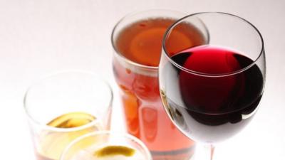 Alcoholic drinks: a pint of beer, a glass of whisky, a gin and tonic and a glass of red wine,