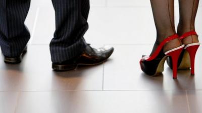 Smart shoes on business man and woman