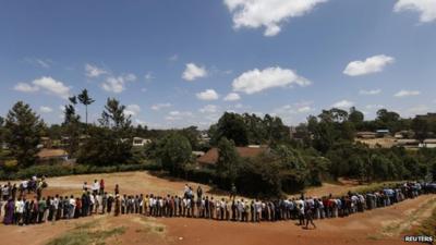 Kenyans wait in line to cast their votes in the Kibera slum in the capital Nairobi