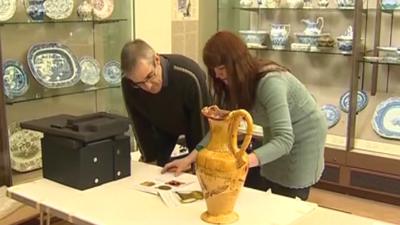 Staff at National Museum Wales pack up the art