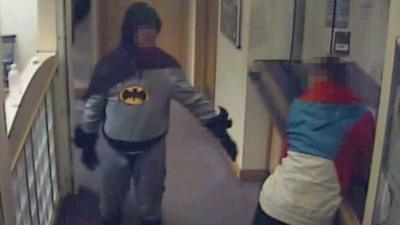 Batman and suspect