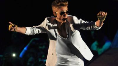 Justin Bieber performing at the O2