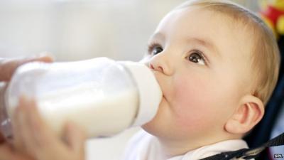 baby drinking bottle of milk