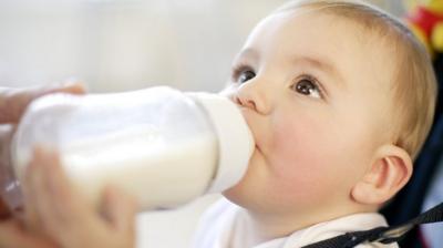 baby drinking bottle of milk