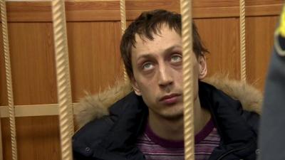 Pavel Dmitrichenko behind bars in courtroom