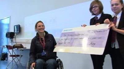 Claire Lomas receiving cheque