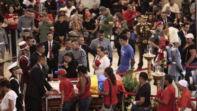 Supporters of Venezuela's late President Chavez viewing his coffin